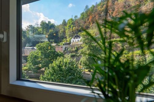 a window with a view of a mountain at Le Comble Amoureux in La Roche-en-Ardenne