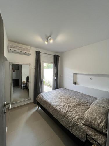a bedroom with a bed and a large mirror at Casaki38 in Heraklio