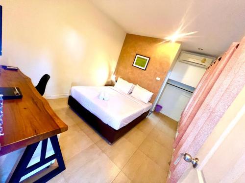 Cama o camas de una habitación en UDEE Cozy Hotel