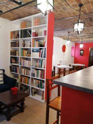 a book shelf filled with books in a room at A casa di Anna in Vaglio Serra