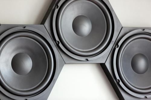 a group of three speakers on a wall at Hotel Indigo - Cardiff by IHG in Cardiff