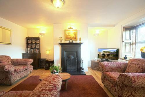 O zonă de relaxare la Riverside Cottage - Luxury Character Holiday Home