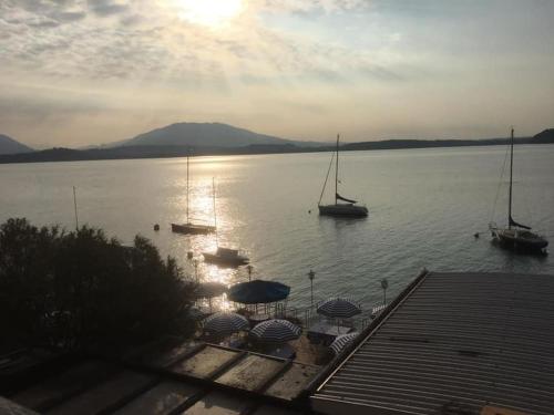 a view of a lake with boats in the water at Ferienwohnung Studio Belvedere in Brezzo