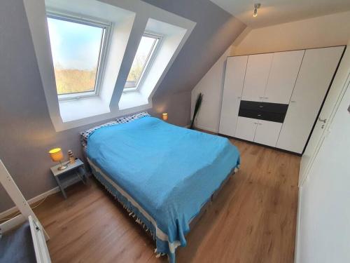 Postel nebo postele na pokoji v ubytování Kiel-Russee Familienwohnung, Lademöglichkeit, Co2 Frei
