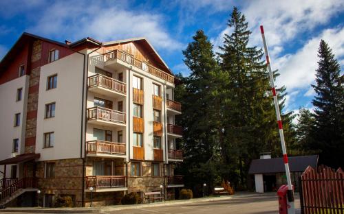 a tall building with balconies on the side of it at GO GO RILA PARK in Borovets
