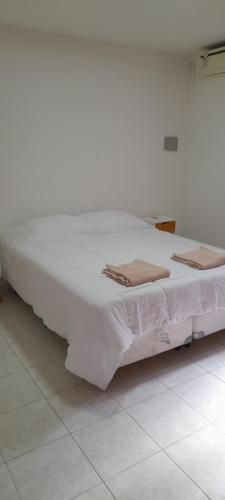 Postel nebo postele na pokoji v ubytování Departamento Maipu centro