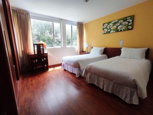 Ένα ή περισσότερα κρεβάτια σε δωμάτιο στο Kur Hotel & Bio Spa
