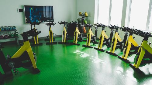 a gym with a bunch of exercise bikes in a room at Old Course Hotel St Andrews in St. Andrews