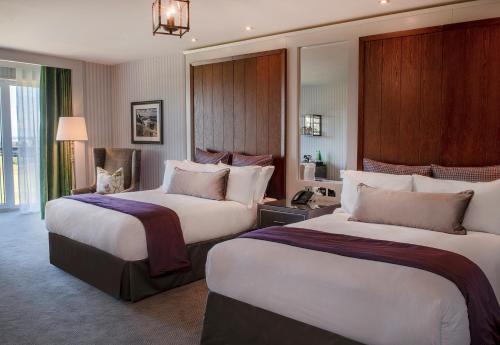 a hotel room with two beds in a room at Old Course Hotel St Andrews in St. Andrews