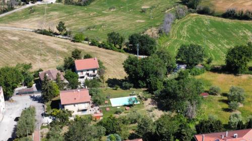 an aerial view of a house with a yard at Antica Fonte holiday home in Tavullia