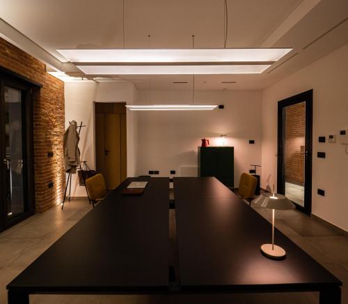 an office with a large black table in a room at Spazio Corrado in Corigliano Calabro