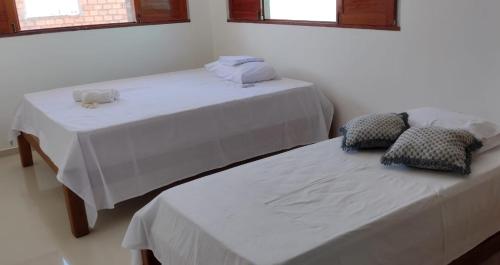 Cama o camas de una habitación en Casa Praia Pontal do Coruripe