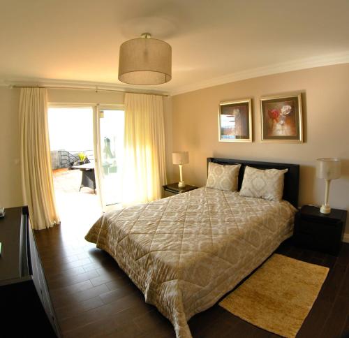 Ένα ή περισσότερα κρεβάτια σε δωμάτιο στο Apartamentos 3 Praias
