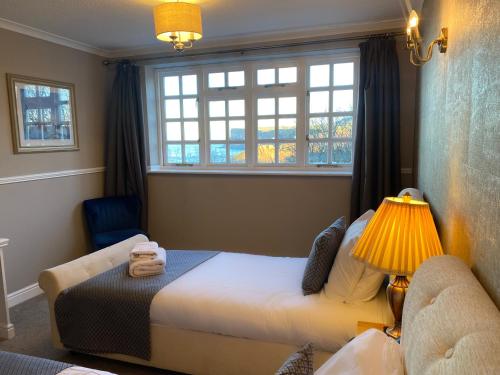 a bedroom with a bed and a window at The Spa Hotel in Saltburn-by-the-Sea