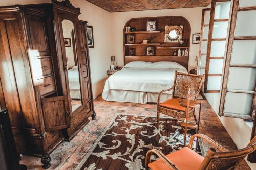 Postel nebo postele na pokoji v ubytování Hacienda Sepulveda Hotel & Spa