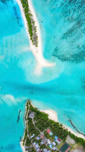 an aerial view of an island in the ocean at Mathiveri Thundi Inn in Mathiveri