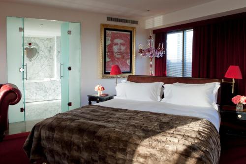 a bedroom with a large bed and a window at Faena Hotel Buenos Aires in Buenos Aires
