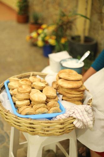 a basket of bagels sitting on a table at Hostel Cultural Pata y Perro in Tarija