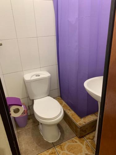 a bathroom with a toilet and a sink at Casa R in Calama