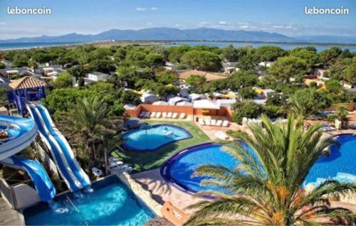 an aerial view of a resort with two pools at Mobil home 3 chambres mar estang 4 étoiles ! in Canet-en-Roussillon