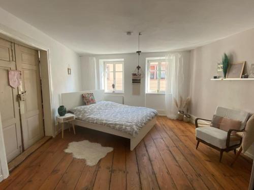 Ένα ή περισσότερα κρεβάτια σε δωμάτιο στο maison de grès
