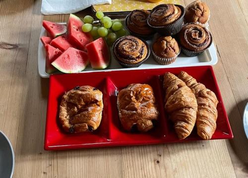 a tray of pastries and fruit on a table at Pilgrims Nap in Rainham