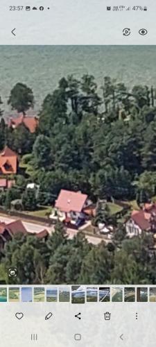 an aerial view of a town with houses and trees at Biały Żagiel - Dom do wynajęcia Pluski in Pluski