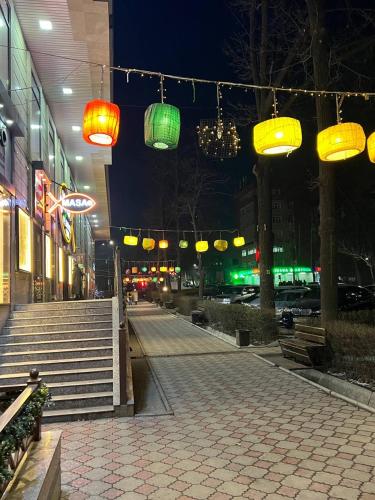 a group of lights hanging over a street at night at 1-room apartment Masaka in Bishkek