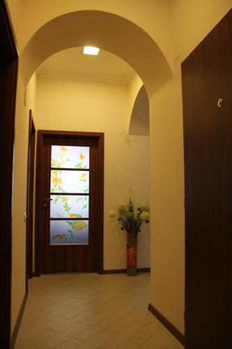 an archway leading to a door with a window at Jurincom apartments in Karlovy Vary