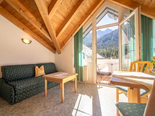 a living room with a couch and a table at Haus Irmgard 2 in Mathon