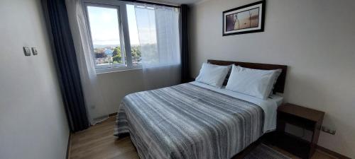 Postel nebo postele na pokoji v ubytování Ainil Apartment