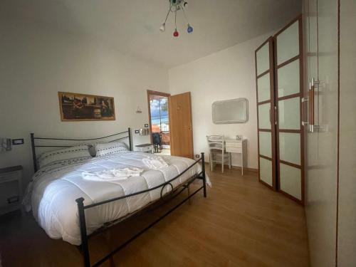 Ένα ή περισσότερα κρεβάτια σε δωμάτιο στο Casa di Roberta