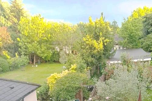 an aerial view of a yard with trees at Private spacious studio Ealing 2 mins from tube in London