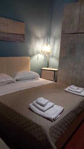 a bedroom with a bed with two towels on it at A casa dell’amica mia in San Nicola Arcella