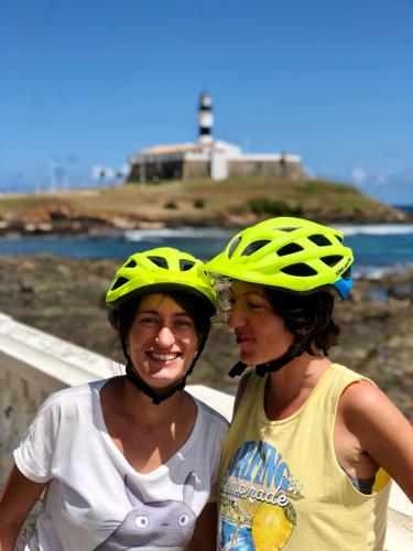 two women wearing helmets standing next to each other at TURISHOUSE SUITES in Salvador
