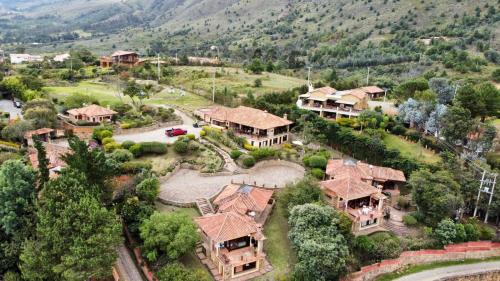 an aerial view of a large house with a mountain at Casas La Primavera in Villa de Leyva