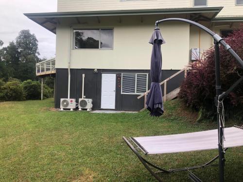 a hammock in the yard of a house at Spiral Gardens Country Park Retreat in Raurimu Spiral