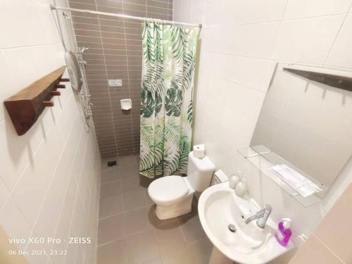 a small bathroom with a toilet and a sink at Austin Palazio @B2/Pool view in Johor Bahru