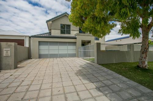 a house with a driveway and a garage at CHILLAX HOUSE - Luxury, Canals, Jetty, Family Friendly - Sleeps 14 in Style! in Mandurah
