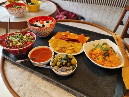 a tray with different types of food on a table at AR Suites Jewels Royale - Koregaon Park NX in Pune