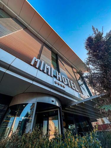 a building with a sign on the front of it at Mimi Hotel Ankara in Ankara