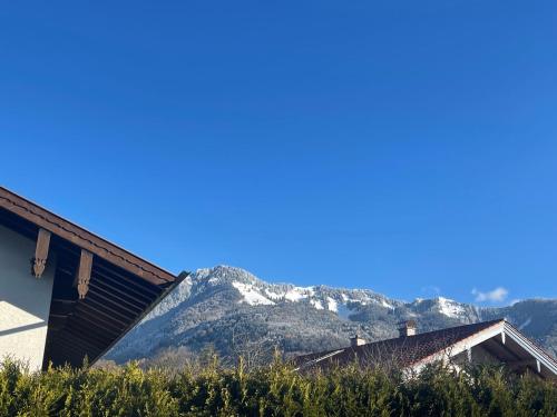 a view of a mountain with snow on it at DEVA Achentaler Vitalhotel in Unterwössen