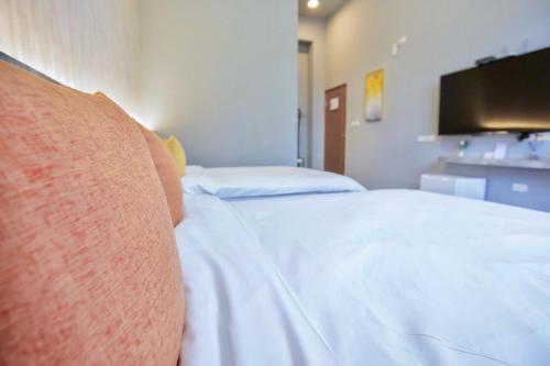 Postel nebo postele na pokoji v ubytování Huayu Homestay