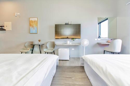 Postel nebo postele na pokoji v ubytování Huayu Homestay