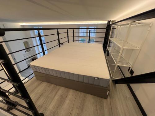 a bedroom with a bed in a room at Pere Lachaise Apartments in Paris