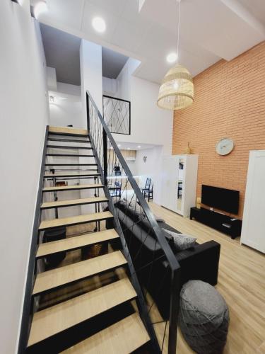 a staircase in a living room with a couch at Carbonell 1 in Valencia