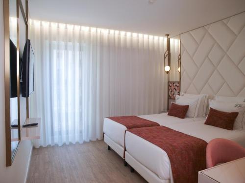 New Style Lisbon Hotelにあるベッド