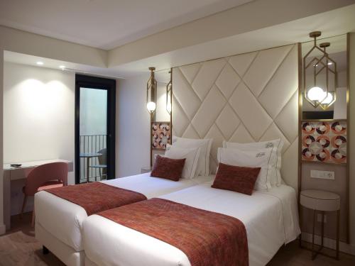 New Style Lisbon Hotelにあるベッド