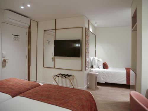 New Style Lisbon Hotelにあるベッド