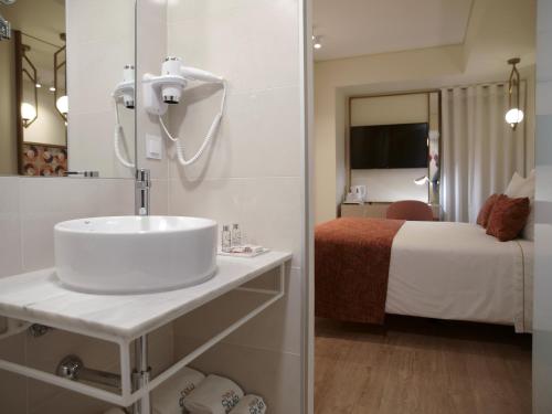 New Style Lisbon Hotelにあるベッド